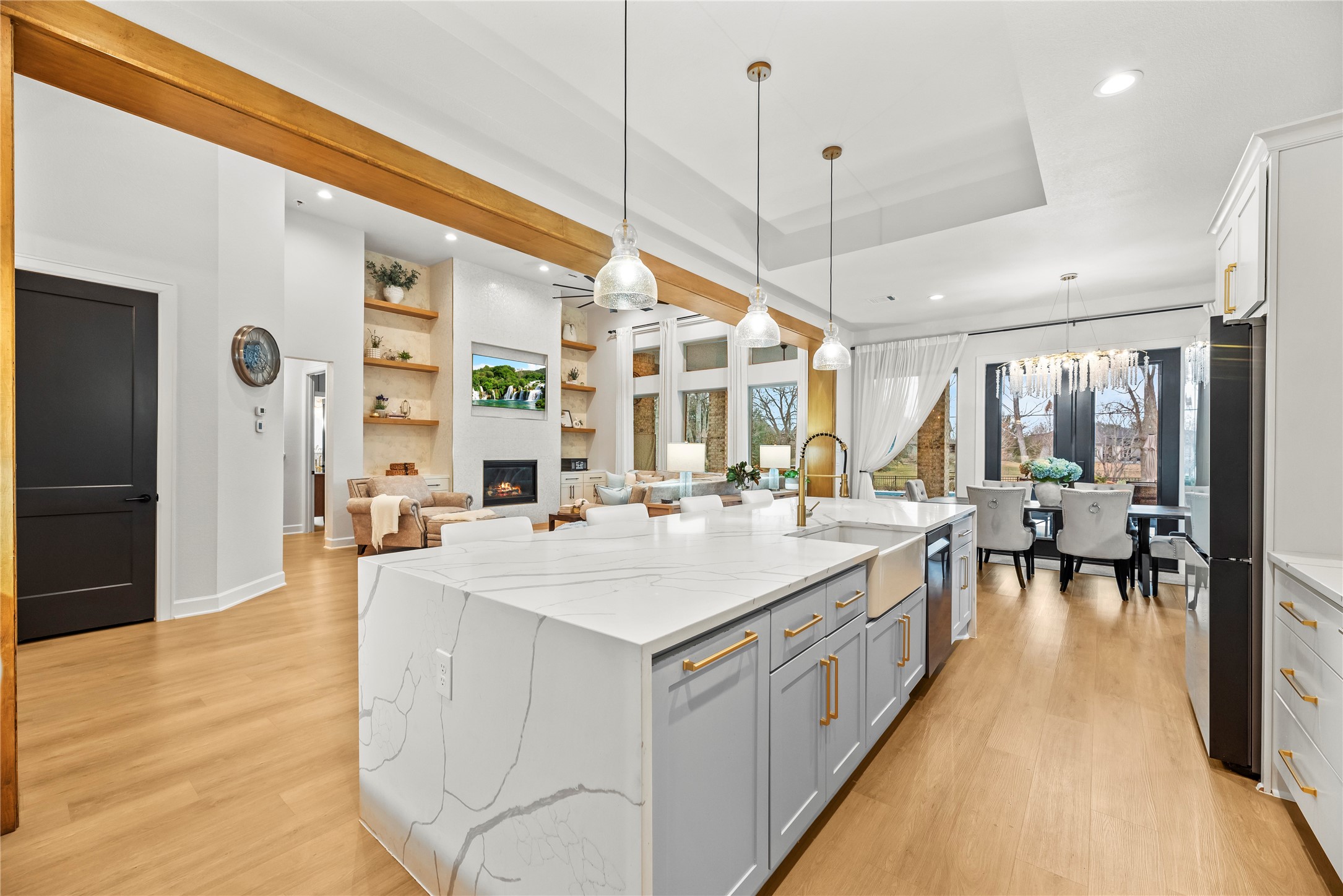 4218 Wooded Isle Way Fulshear, TX 77441 - Photo 16 of 50 a large kitchen with kitchen island a large island in it