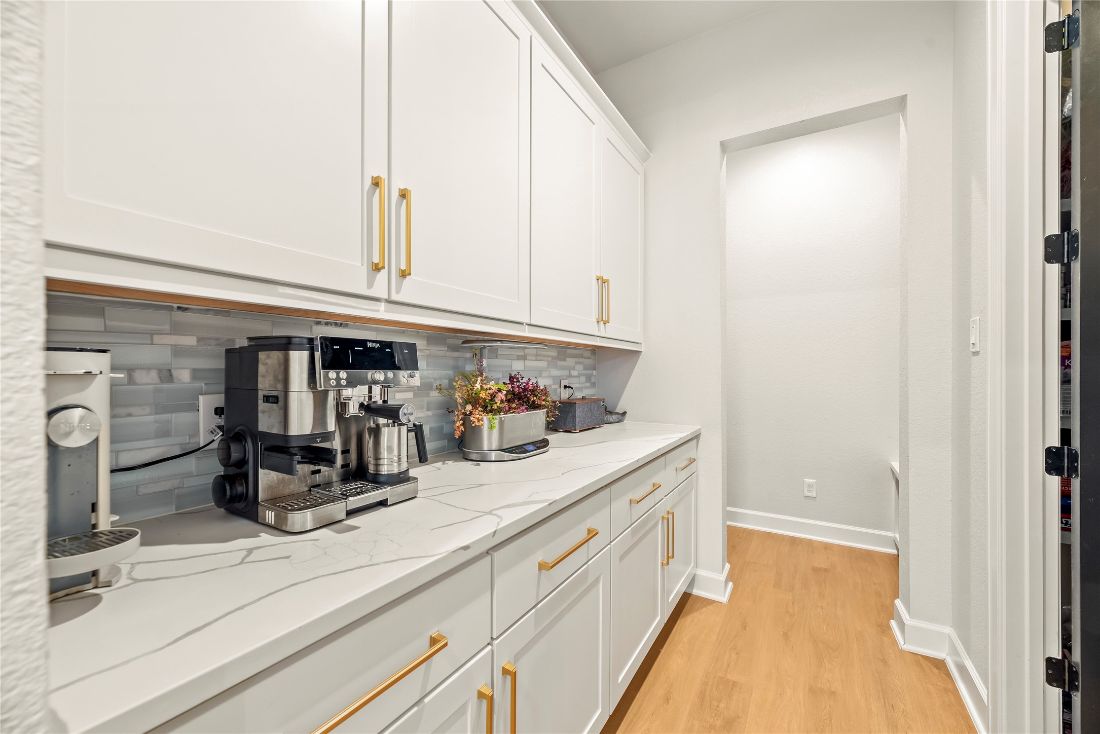 4218 Wooded Isle Way Fulshear, TX 77441 - Photo 19 of 50 a kitchen with a sink and cabinets