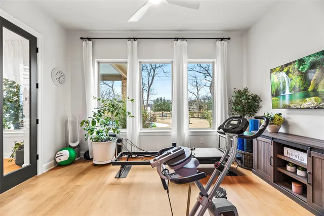 a living room with furniture a rug and a flat screen tv
