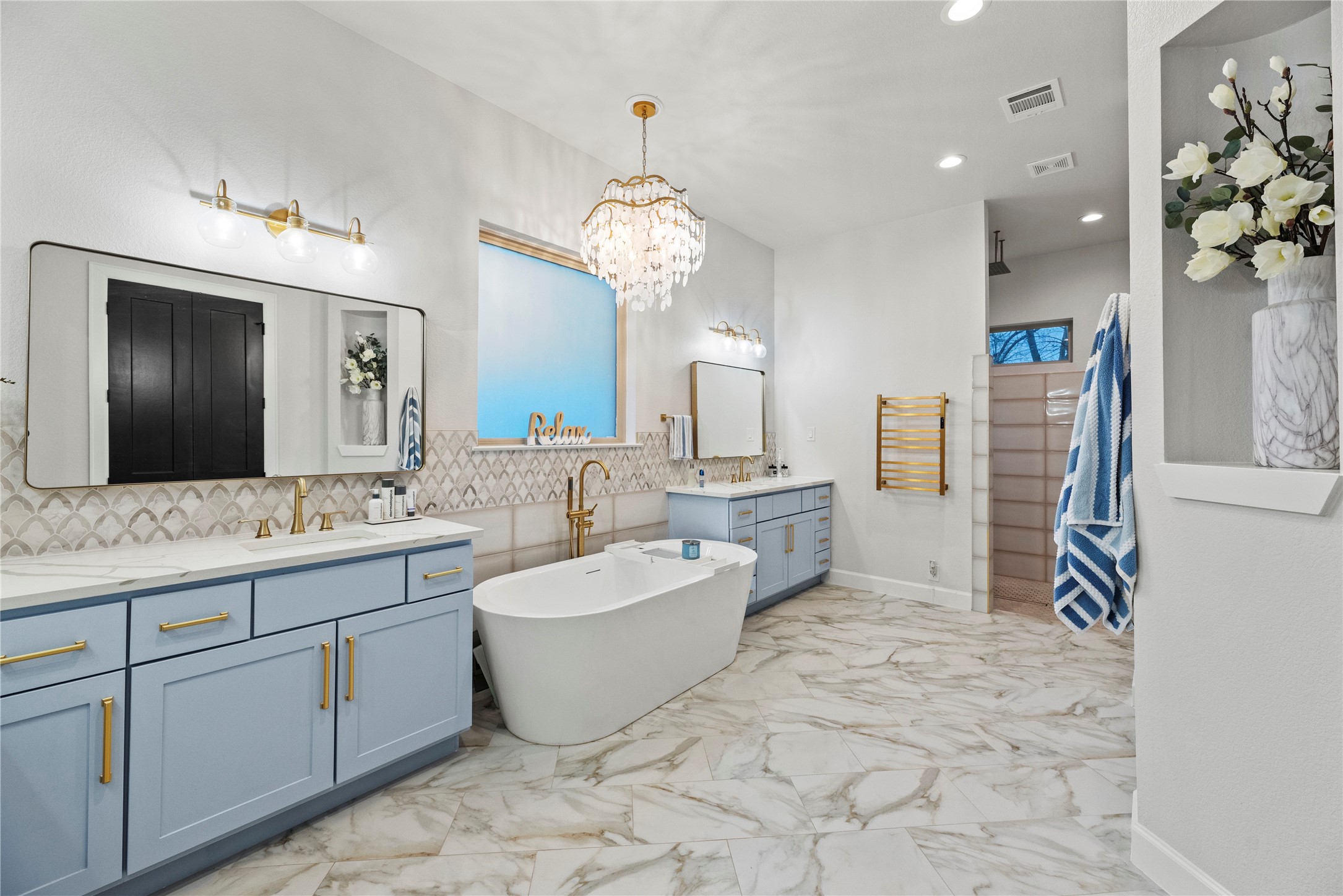 4218 Wooded Isle Way Fulshear, TX 77441 - Photo 25 of 50 a spacious bathroom with a double vanity sink mirror and bathtub