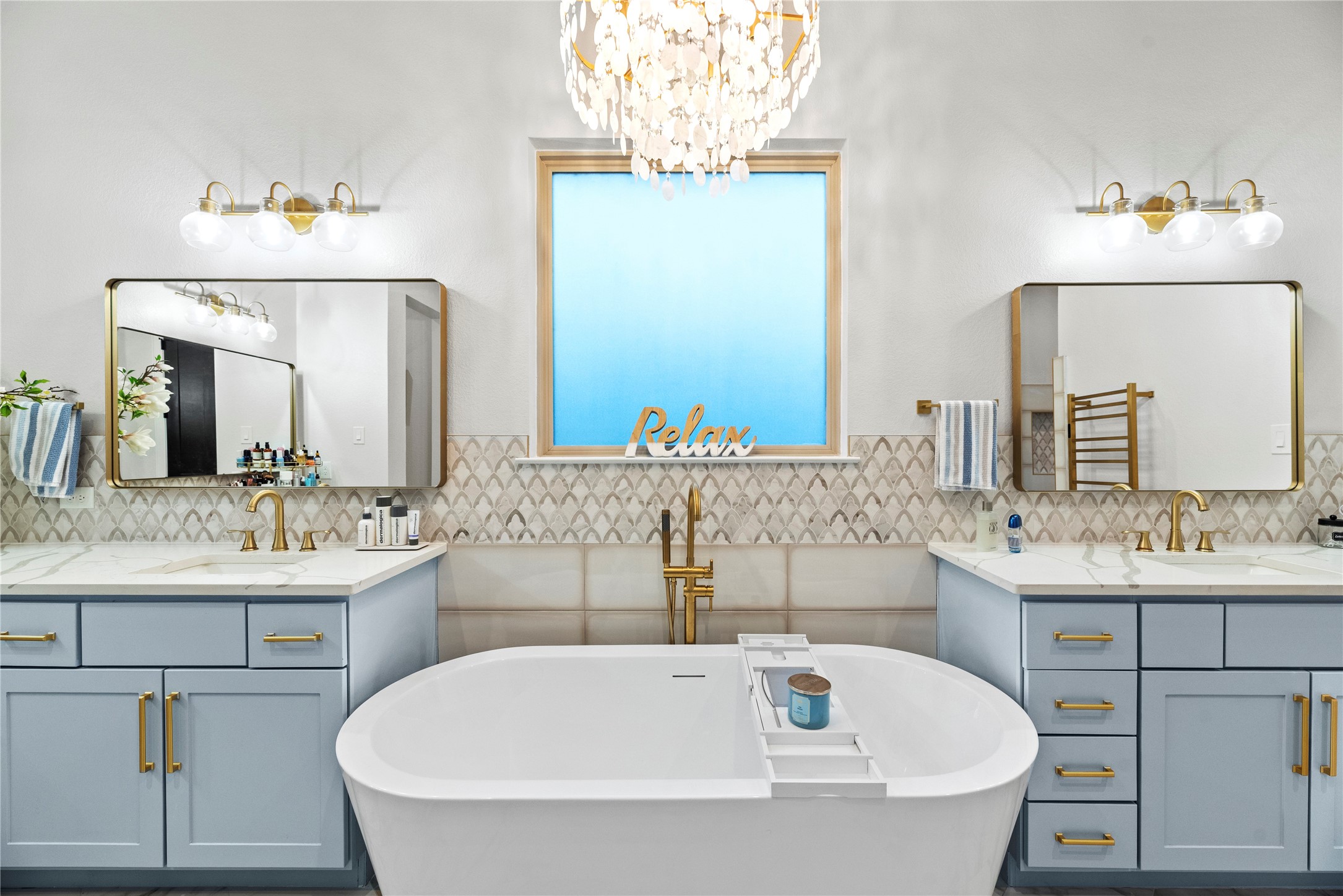 4218 Wooded Isle Way Fulshear, TX 77441 - Photo 26 of 50 a bathroom with a tub sink and mirror