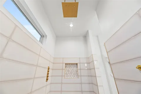 a bathroom with a sink toilet and mirror