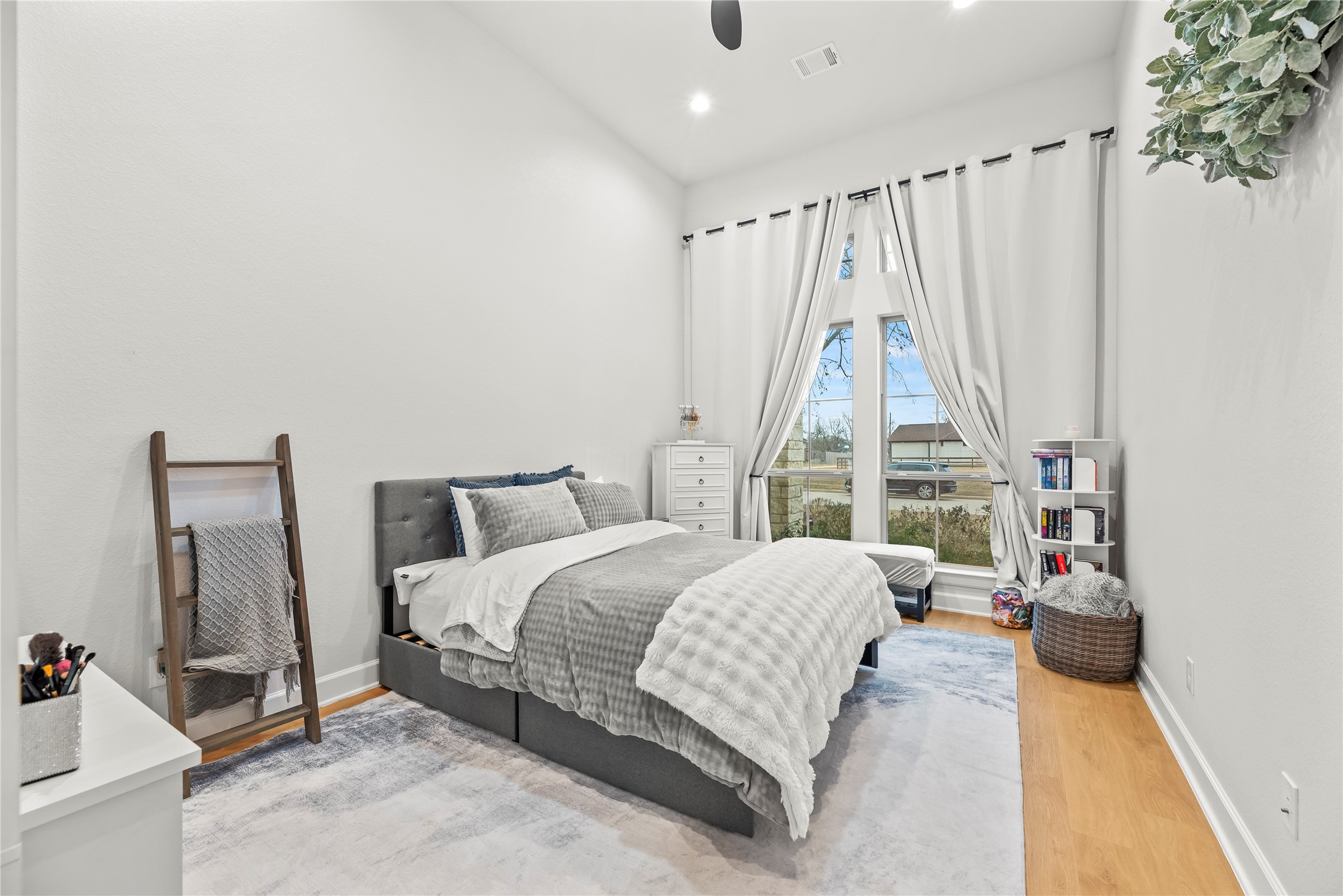 4218 Wooded Isle Way Fulshear, TX 77441 - Photo 31 of 50 a bedroom with a bed and a large window