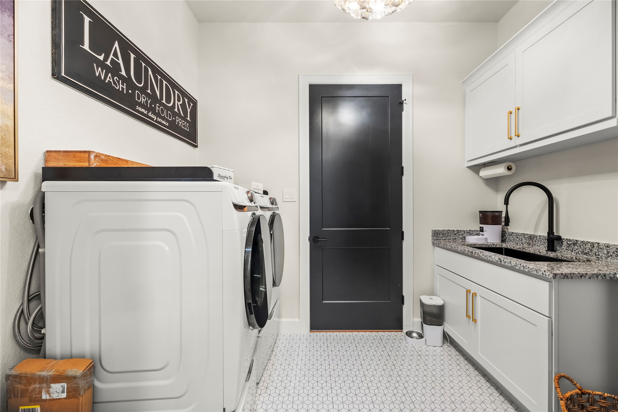 4218 Wooded Isle Way Fulshear, TX 77441 - Photo 35 of 50 a kitchen with a refrigerator and a sink