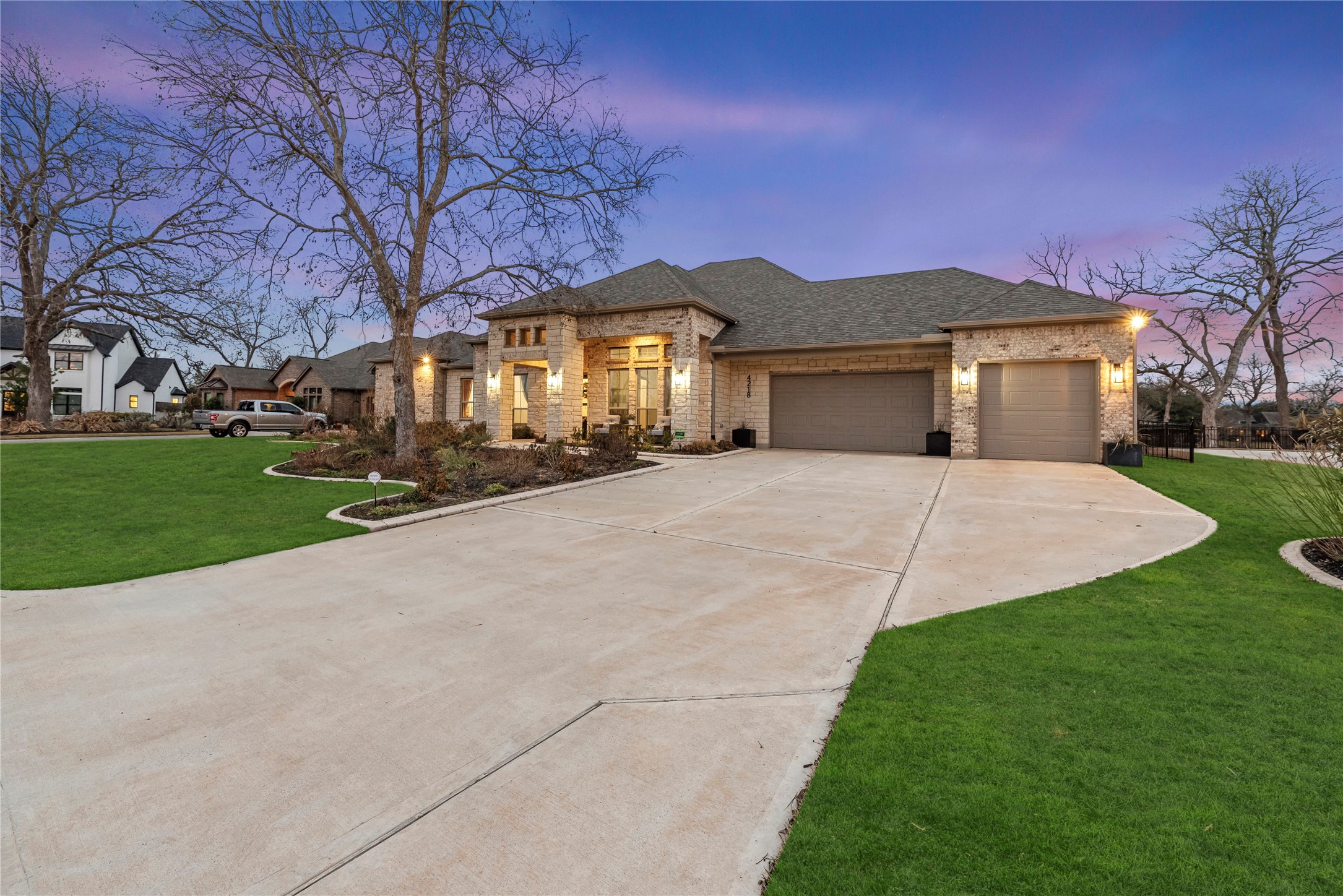 4218 Wooded Isle Way Fulshear, TX 77441 - Photo 4 of 50 a front view of a house with a yard and garage