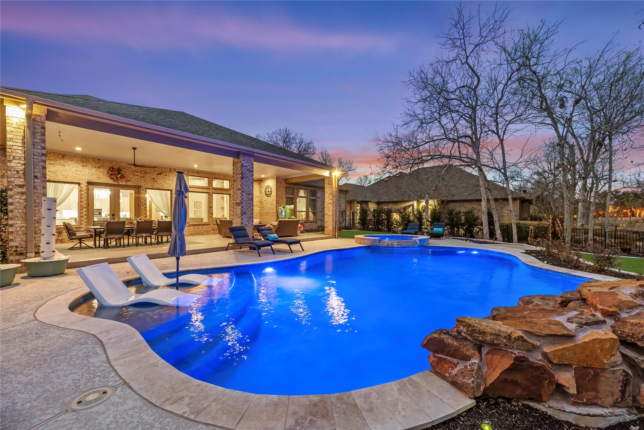 4218 Wooded Isle Way Fulshear, TX 77441 - Photo 40 of 50 a view of a swimming pool with seating area