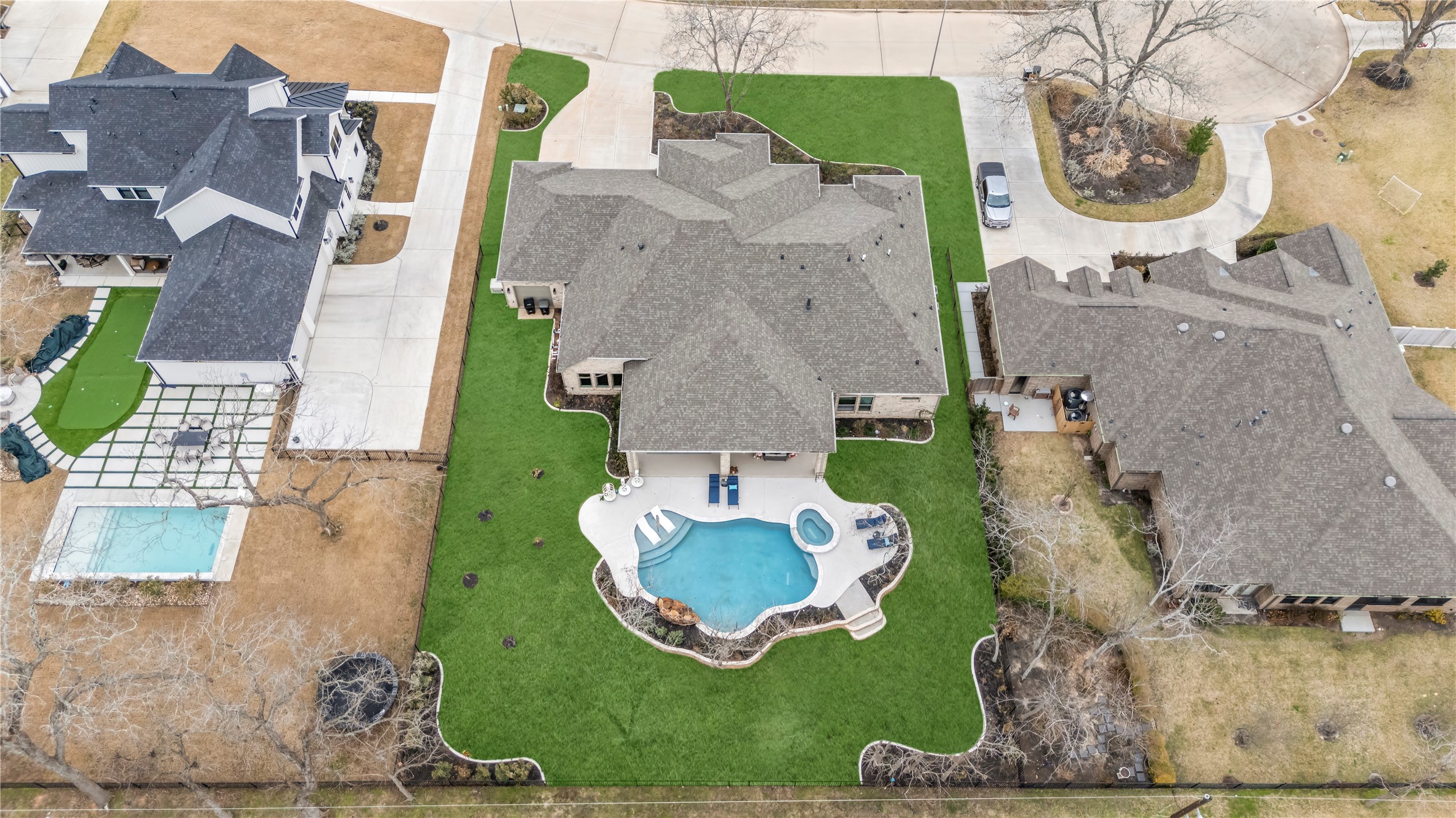 4218 Wooded Isle Way Fulshear, TX 77441 - Photo 43 of 50 an aerial view of a house with a swimming pool