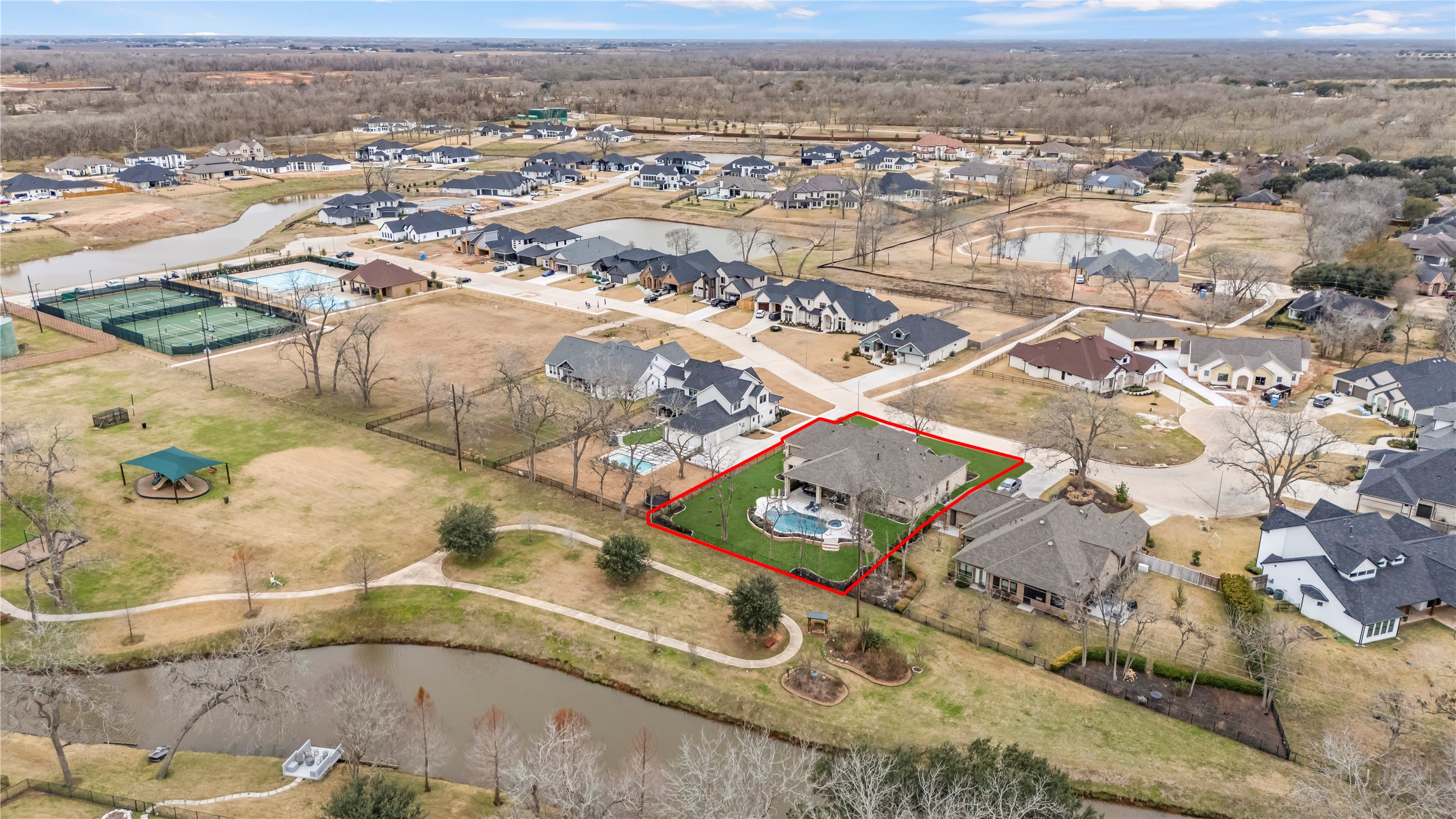 4218 Wooded Isle Way Fulshear, TX 77441 - Photo 48 of 50 an aerial view of residential houses with outdoor space