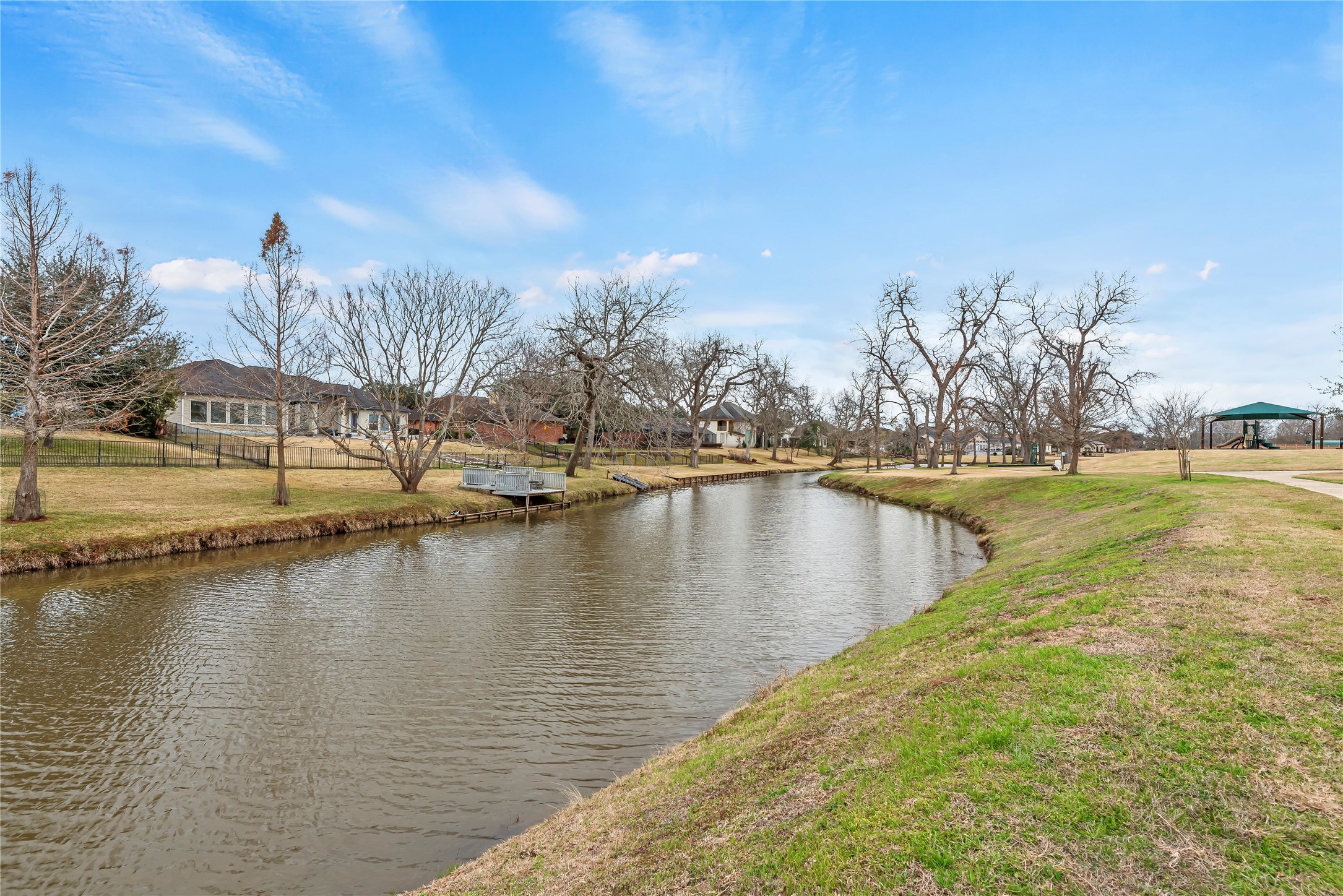 4218 Wooded Isle Way Fulshear, TX 77441 - Photo 49 of 50 a view of a lake with houses