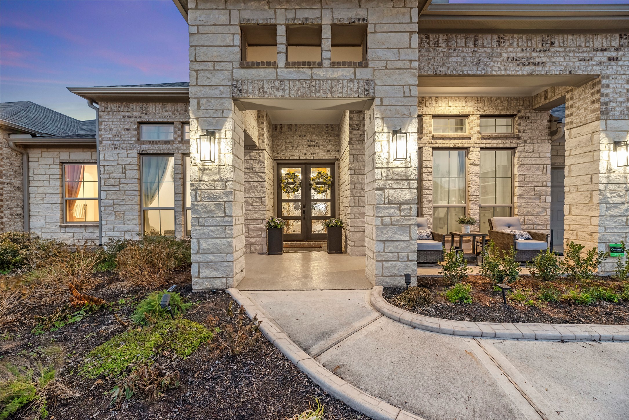4218 Wooded Isle Way Fulshear, TX 77441 - Photo 6 of 50 a view of a brick house with large windows