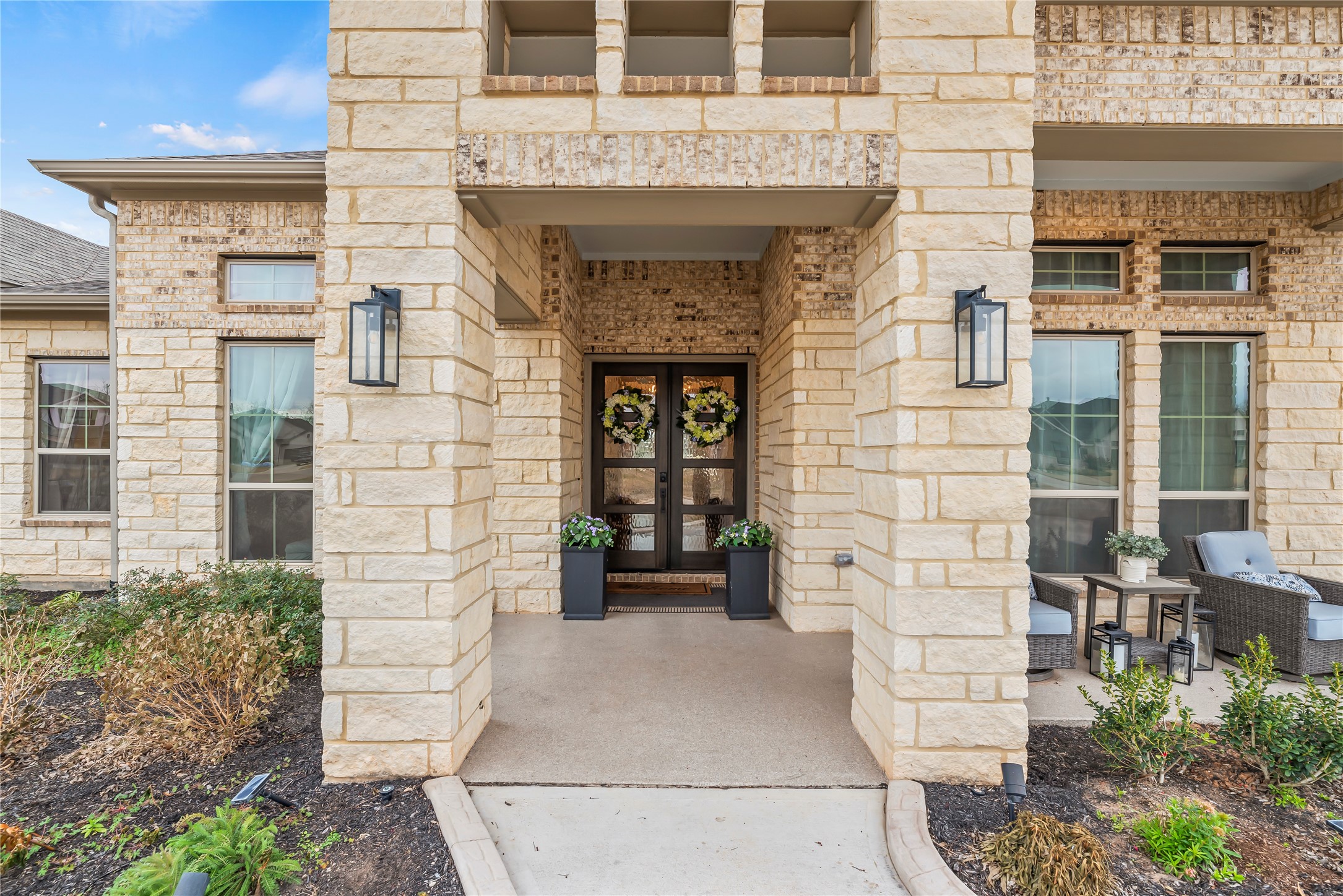 4218 Wooded Isle Way Fulshear, TX 77441 - Photo 7 of 50 a front view of a house with a garage