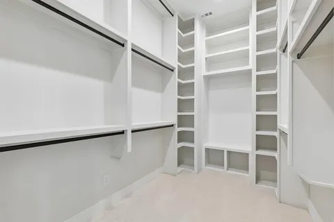 a view of an empty walk in closet