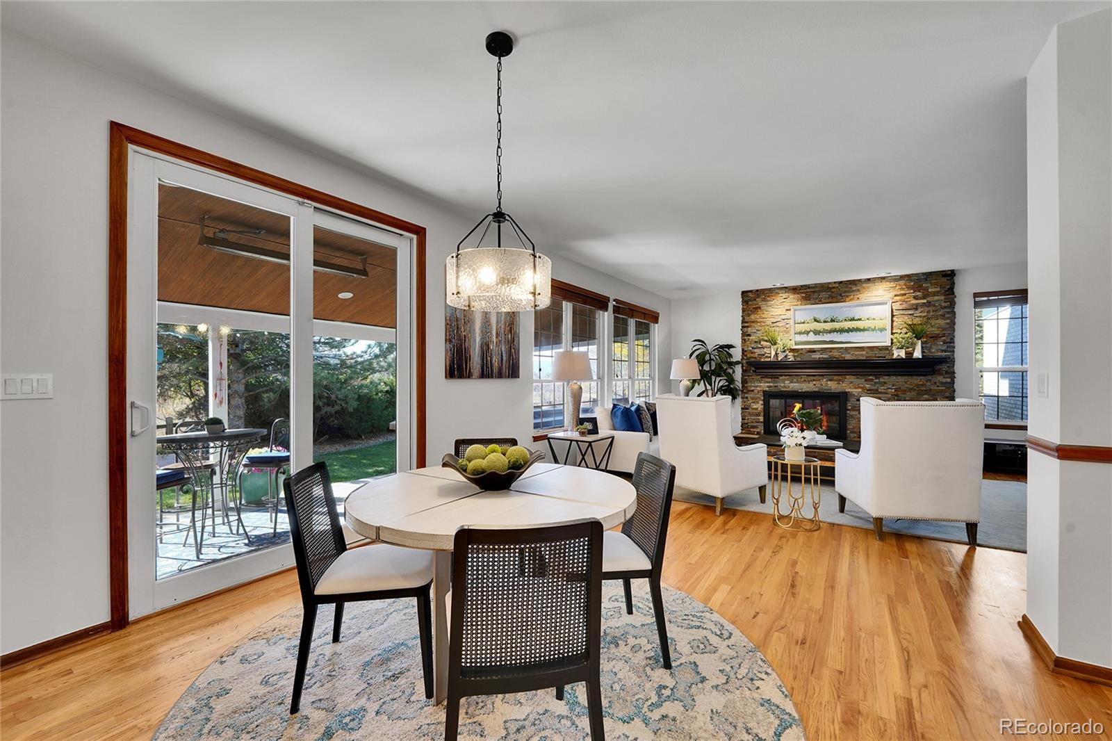 2226 Thistle Ridge Circle Highlands Ranch, CO 80126 - Photo 13 of 49 a view of a dining room with furniture window and wooden floor