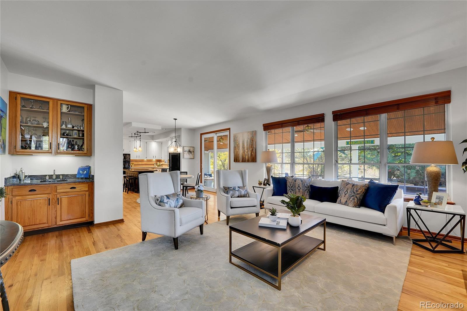 2226 Thistle Ridge Circle Highlands Ranch, CO 80126 - Photo 16 of 49 a living room with fireplace furniture and floor to ceiling windows