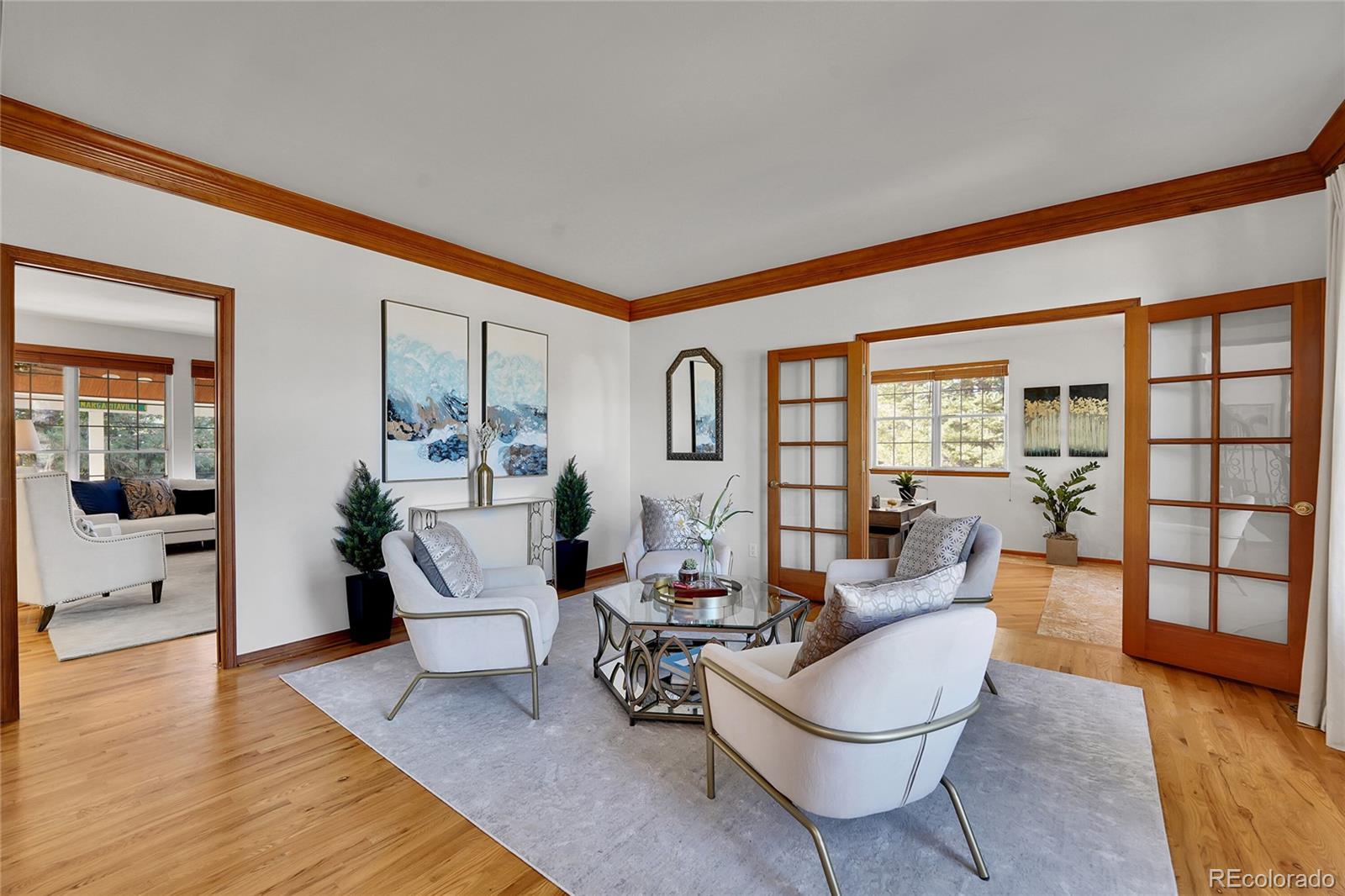 2226 Thistle Ridge Circle Highlands Ranch, CO 80126 - Photo 19 of 49 a living room with furniture and a wooden floor