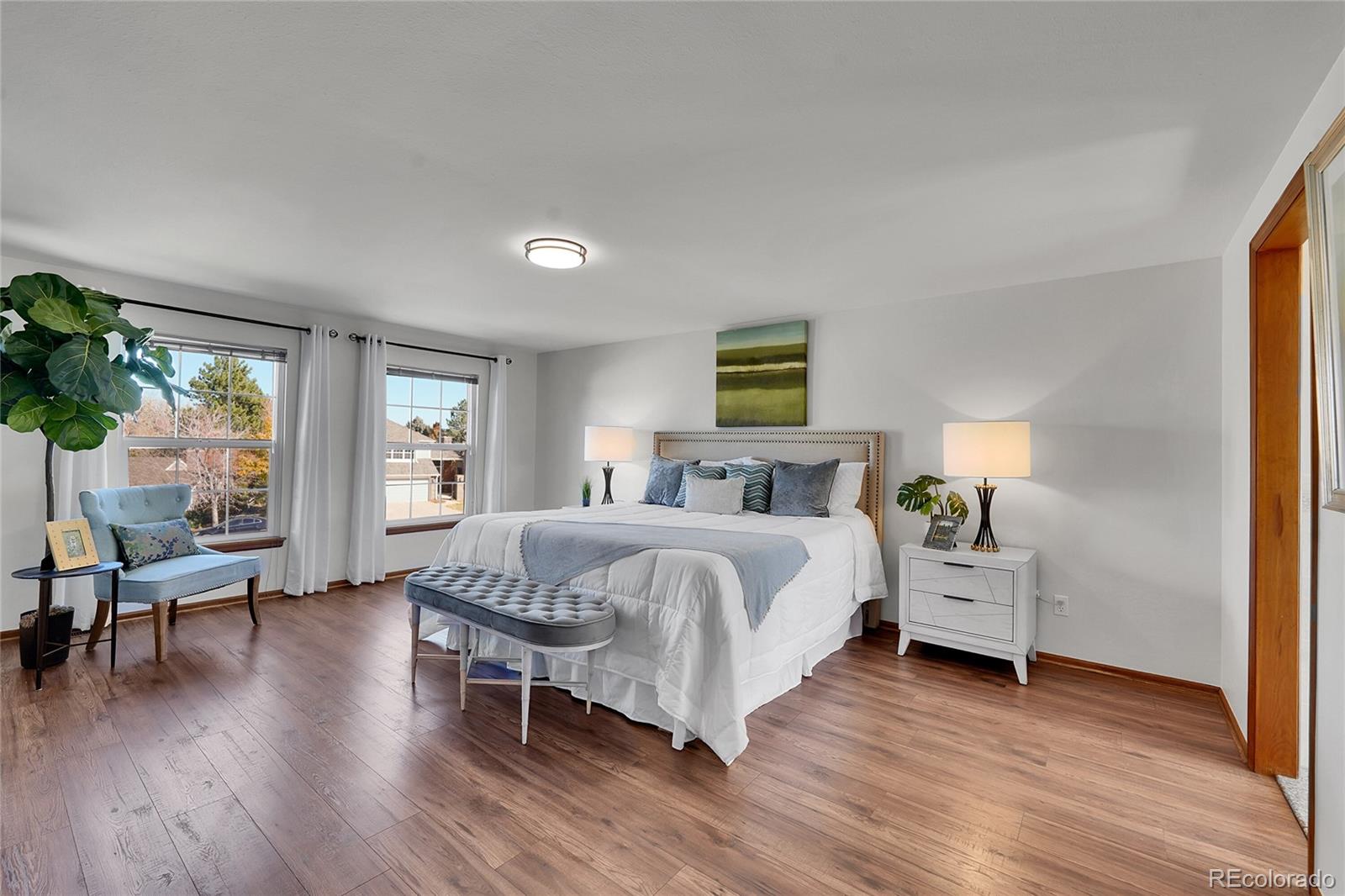 2226 Thistle Ridge Circle Highlands Ranch, CO 80126 - Photo 21 of 49 a bed room with bed and a chair