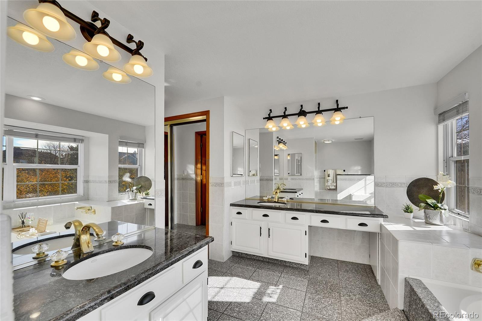 2226 Thistle Ridge Circle Highlands Ranch, CO 80126 - Photo 24 of 49 a bathroom with a granite countertop sink double vanity and mirror