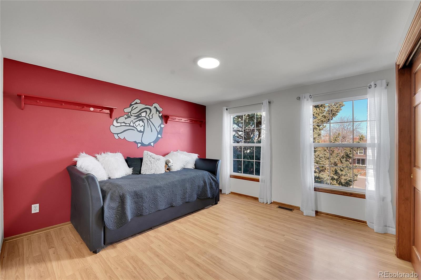 2226 Thistle Ridge Circle Highlands Ranch, CO 80126 - Photo 28 of 49 a bedroom with a large bed and a window