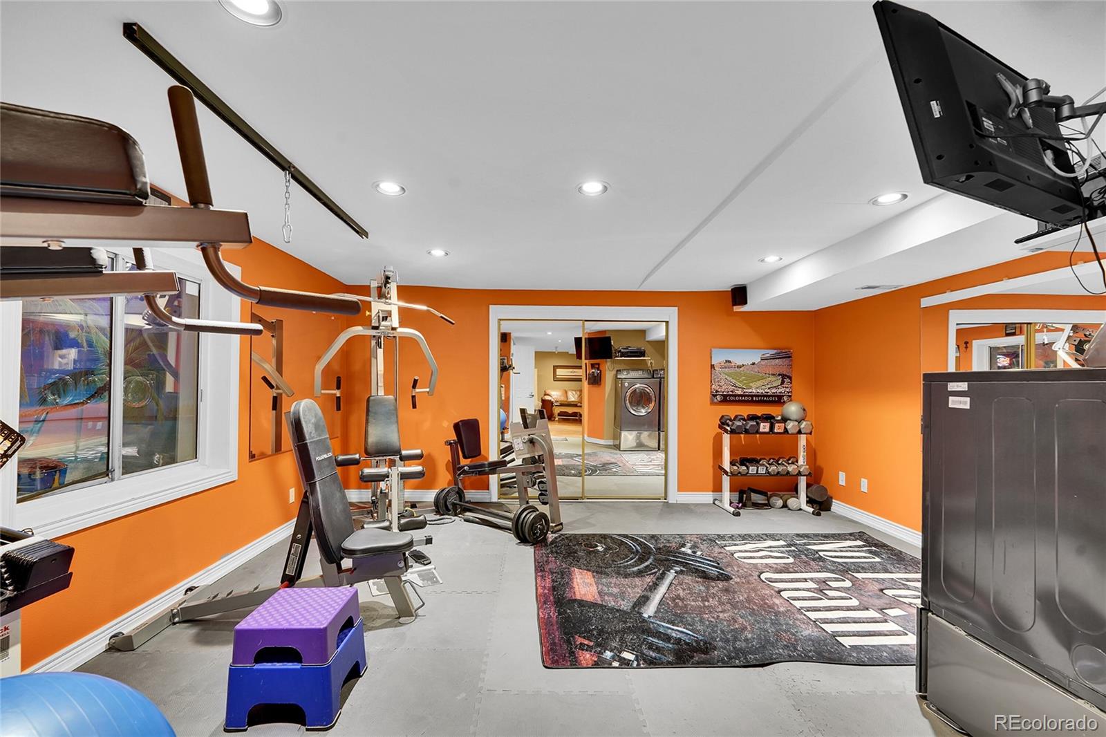 2226 Thistle Ridge Circle Highlands Ranch, CO 80126 - Photo 34 of 49 a living room with furniture a rug and a large window