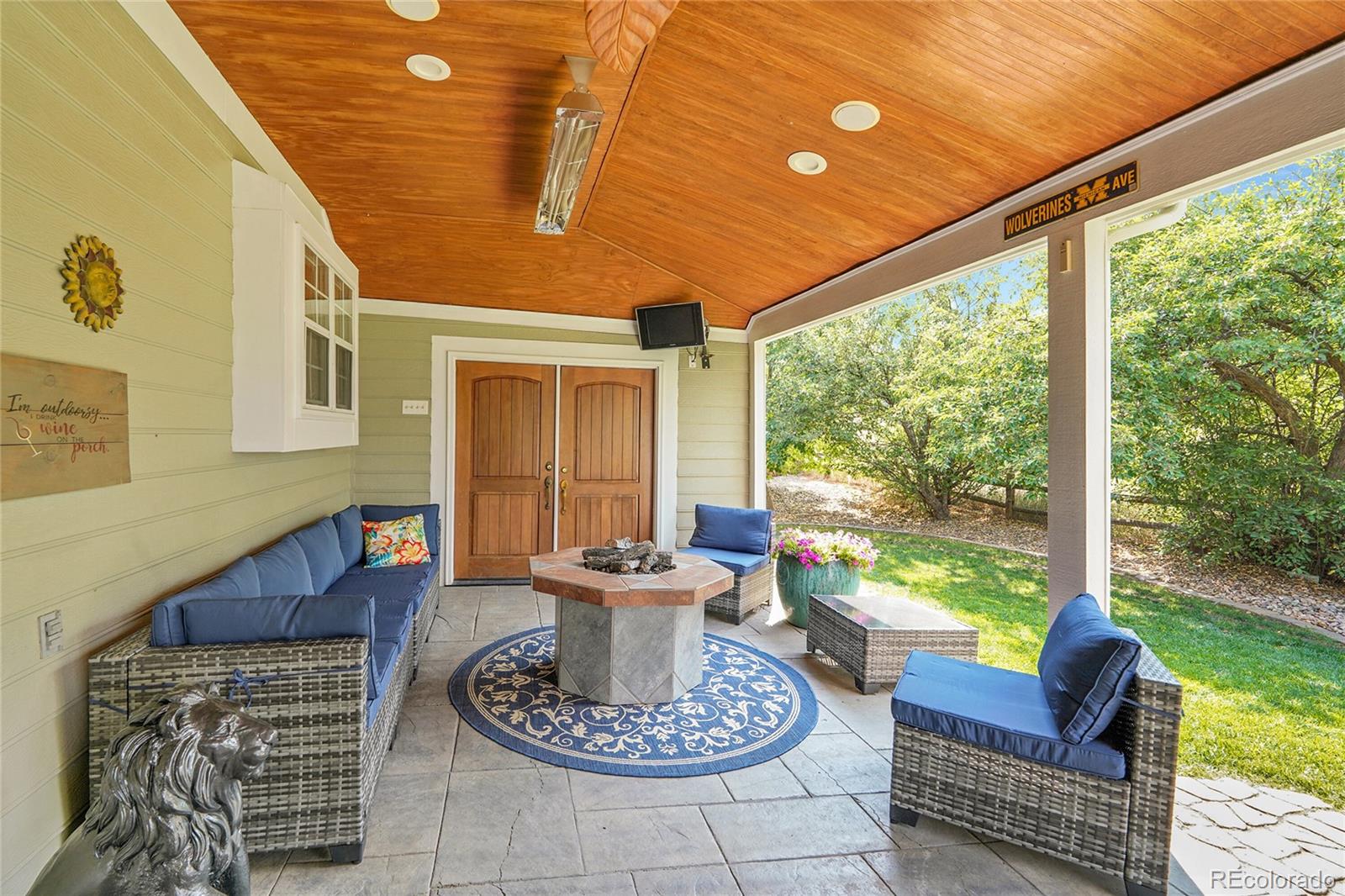 2226 Thistle Ridge Circle Highlands Ranch, CO 80126 - Photo 38 of 49 a living room with furniture and a floor to ceiling window