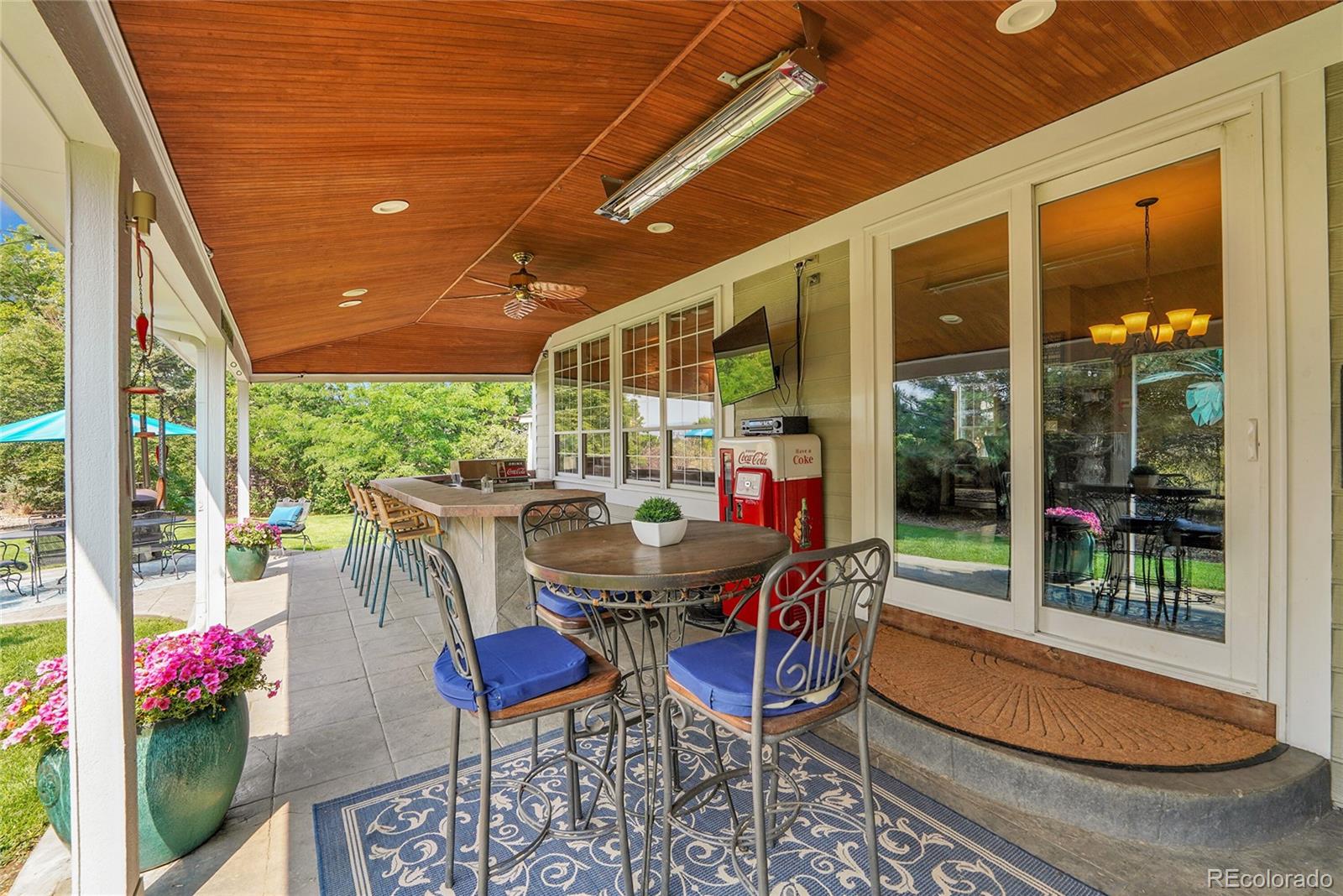 2226 Thistle Ridge Circle Highlands Ranch, CO 80126 - Photo 39 of 49 a view of a patio with a dining table and chairs