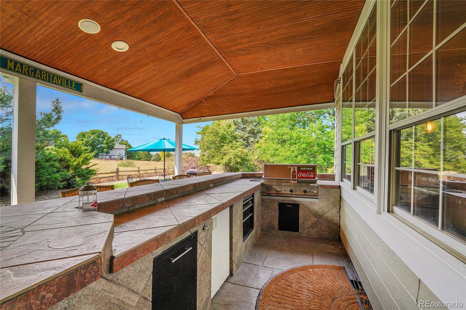 2226 Thistle Ridge Circle Highlands Ranch, CO 80126 - Photo 41 of 49 a kitchen with stainless steel appliances wooden cabinets and a stove
