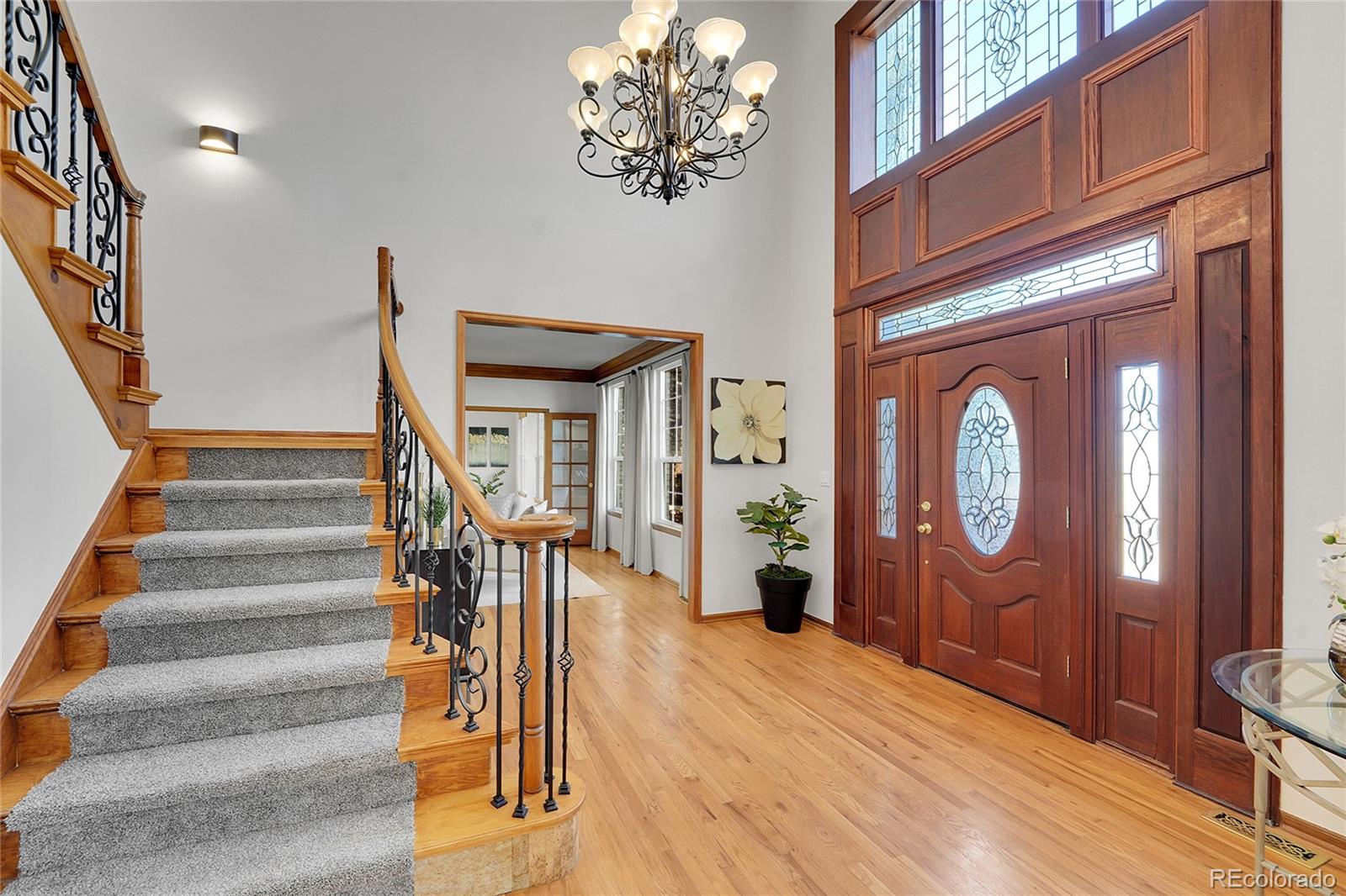 2226 Thistle Ridge Circle Highlands Ranch, CO 80126 - Photo 5 of 49 a view of entryway and hall with wooden floor