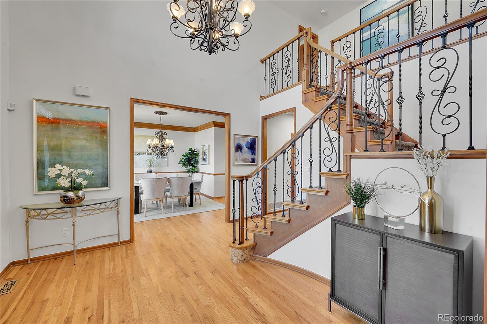 2226 Thistle Ridge Circle Highlands Ranch, CO 80126 - Photo 6 of 49 a living room with fireplace furniture and a wooden floor