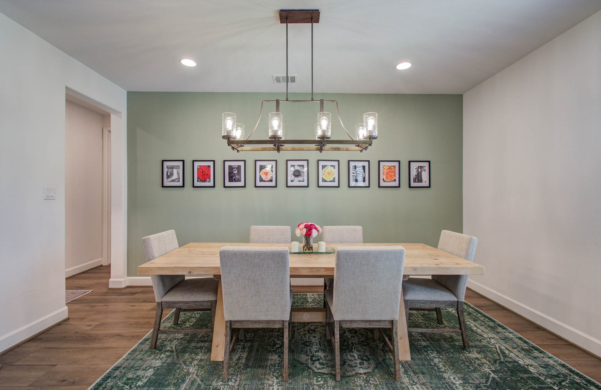 24430 Switchgrass Vly Way Katy, TX 77493 - Photo 5 of 50 This dining room features a modern chandelier. The space is bright and inviting, with recessed lighting enhancing the decor.