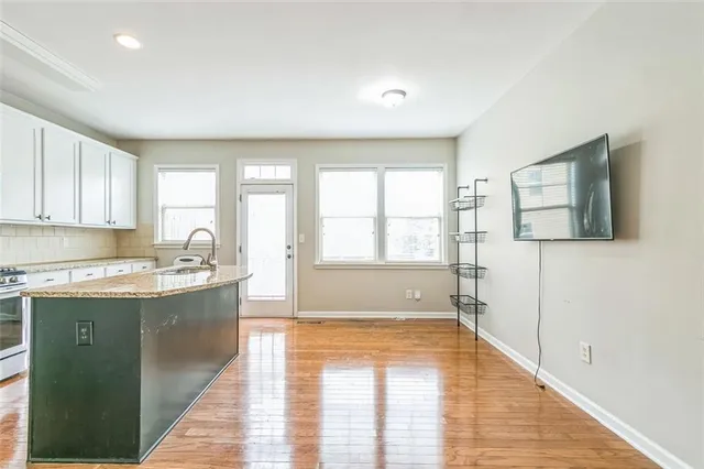 a large kitchen with a window