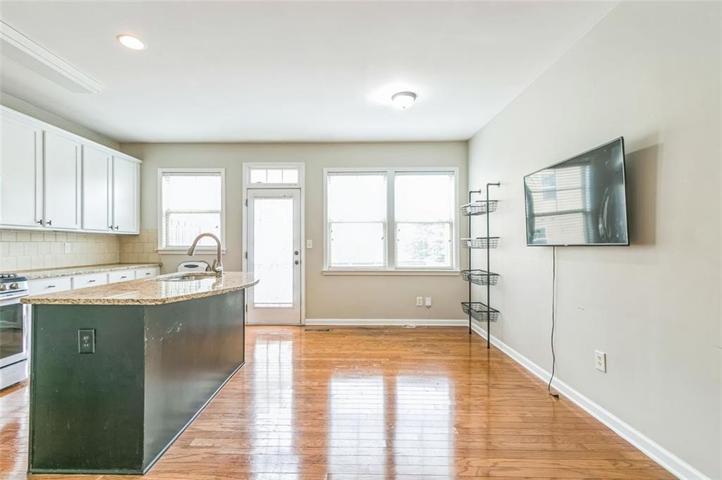 4358 Grove Field Court Northwest Suwanee, GA 30024 - Photo 9 of 17 a large kitchen with a window