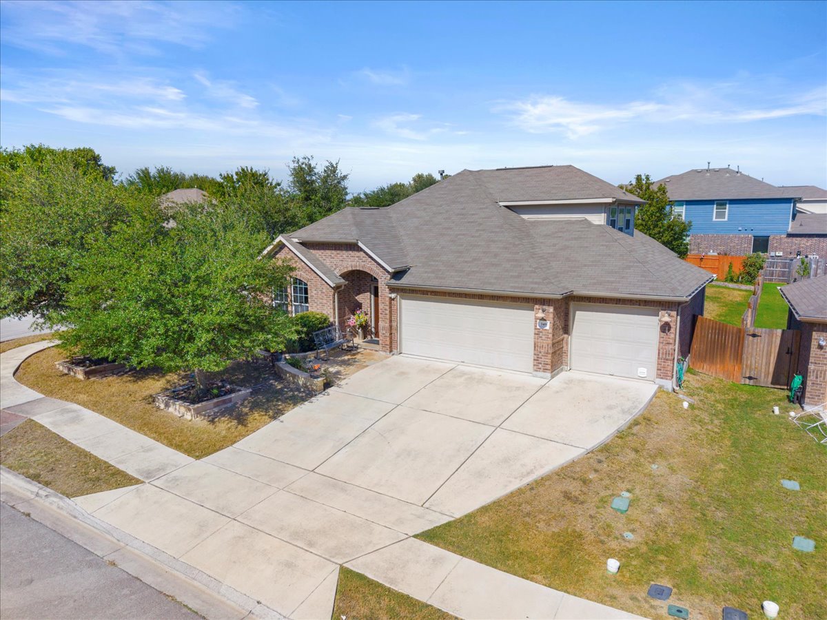 349 Razzmatazz Trail Buda, TX 78610 - Photo 4 of 40 a aerial view of a house with a yard