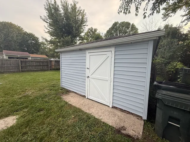a kitchen with stainless steel appliances granite countertop a stove top oven a sink dishwasher and a refrigerator