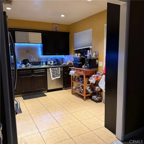 a kitchen with stainless steel appliances a sink and a stove top oven
