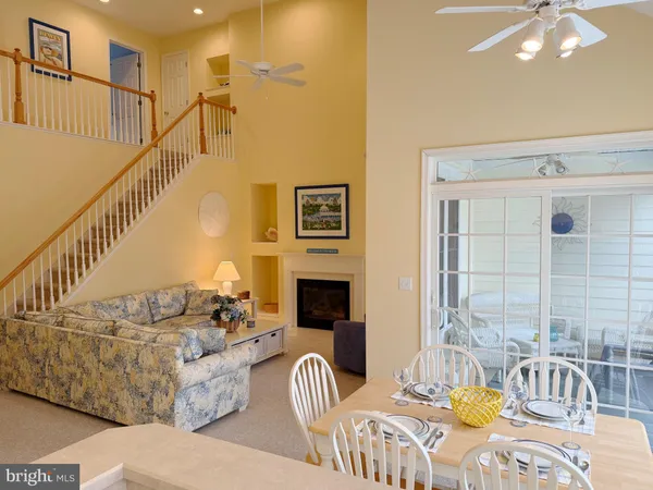 a view of a livingroom with furniture and a floor to ceiling window
