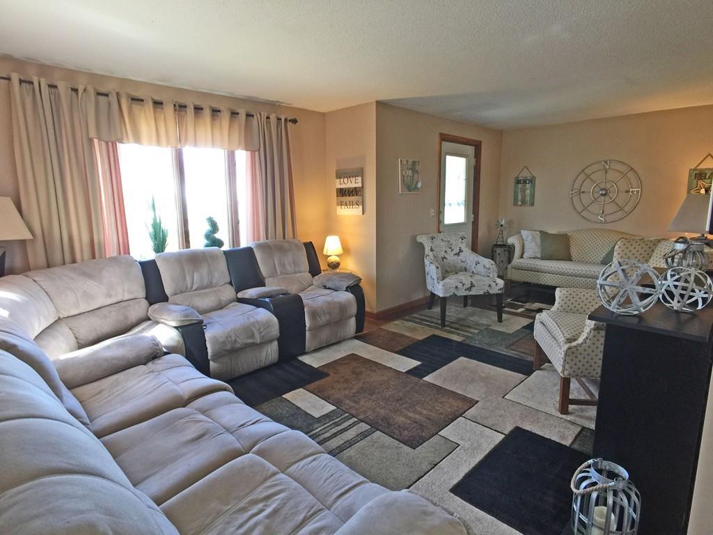 28 Dundee Street Fall River, MA 02721 - Photo 12 of 28 a living room with furniture couches and a large window
