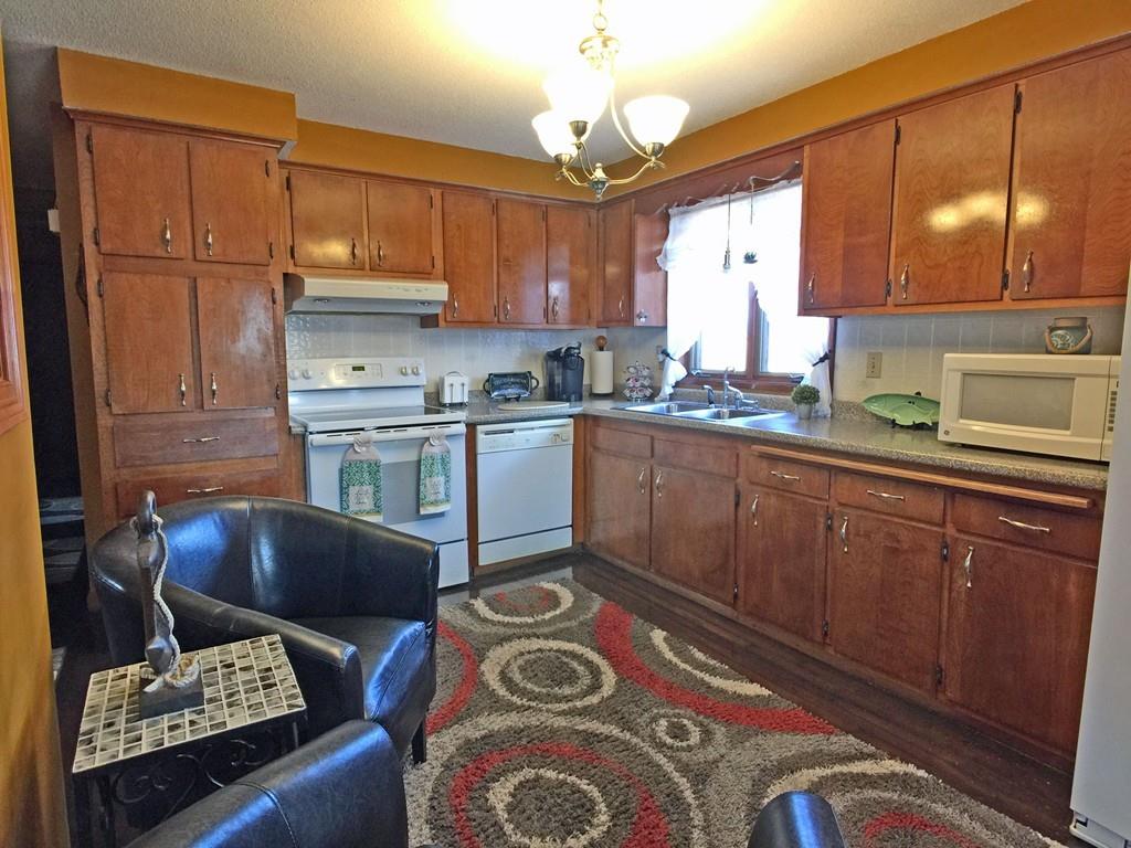 28 Dundee Street Fall River, MA 02721 - Photo 9 of 28 a kitchen with stainless steel appliances granite countertop a sink stove and cabinets