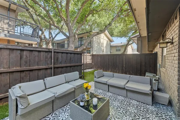 a view of a couches in the back yard of the house