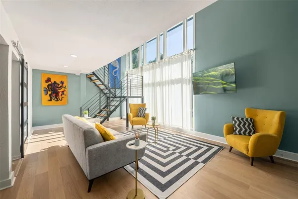 a living room with furniture and a window