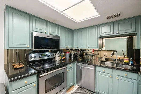a kitchen with table and chairs