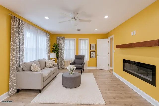 a living room with furniture and a fireplace