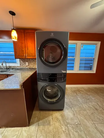 a bedroom with a bed and a potted plant