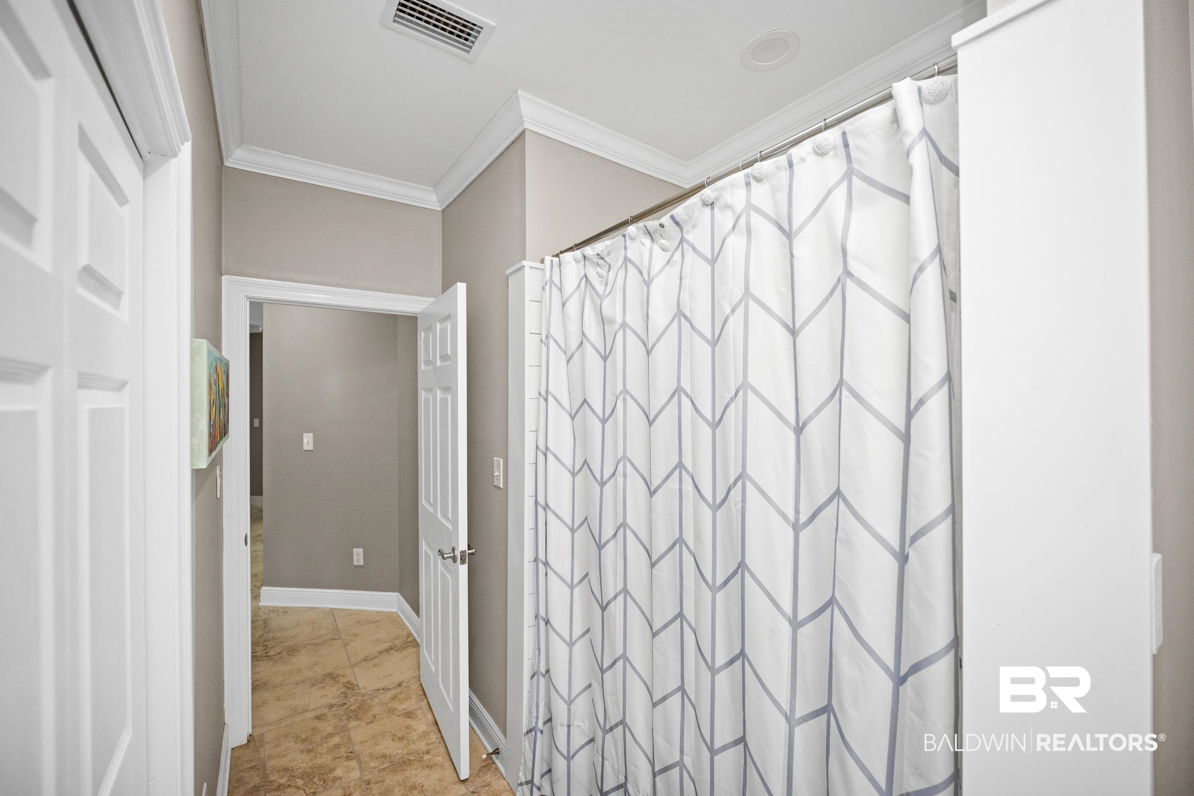 5217 Greentree Road Orange Beach, AL 36561 - Photo 49 of 58 Full bathroom featuring a shower with shower curtain and crown molding