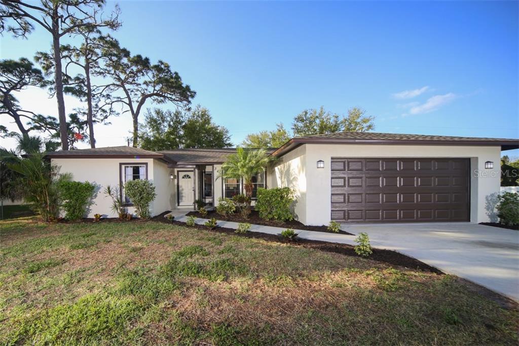 343 Argus Road Venice, FL 34293 - Photo 1 of 1 front view of a house with a yard