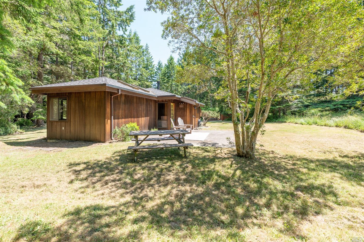 36688 Timber Ridge Road The Sea Ranch, CA 95497 - Photo 1 of 1 a house with trees in the background