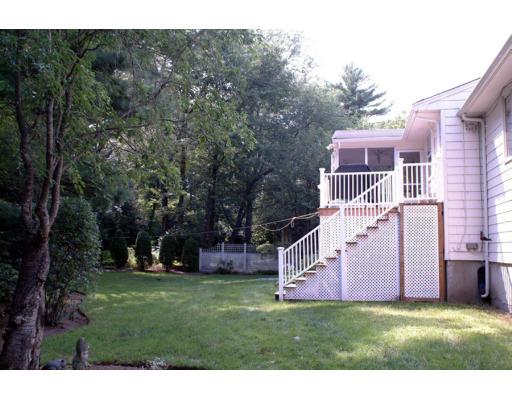 153 Meadowbrook Road Needham, MA 02492 - Photo 6 of 9 a view of a big house with a big yard and large trees