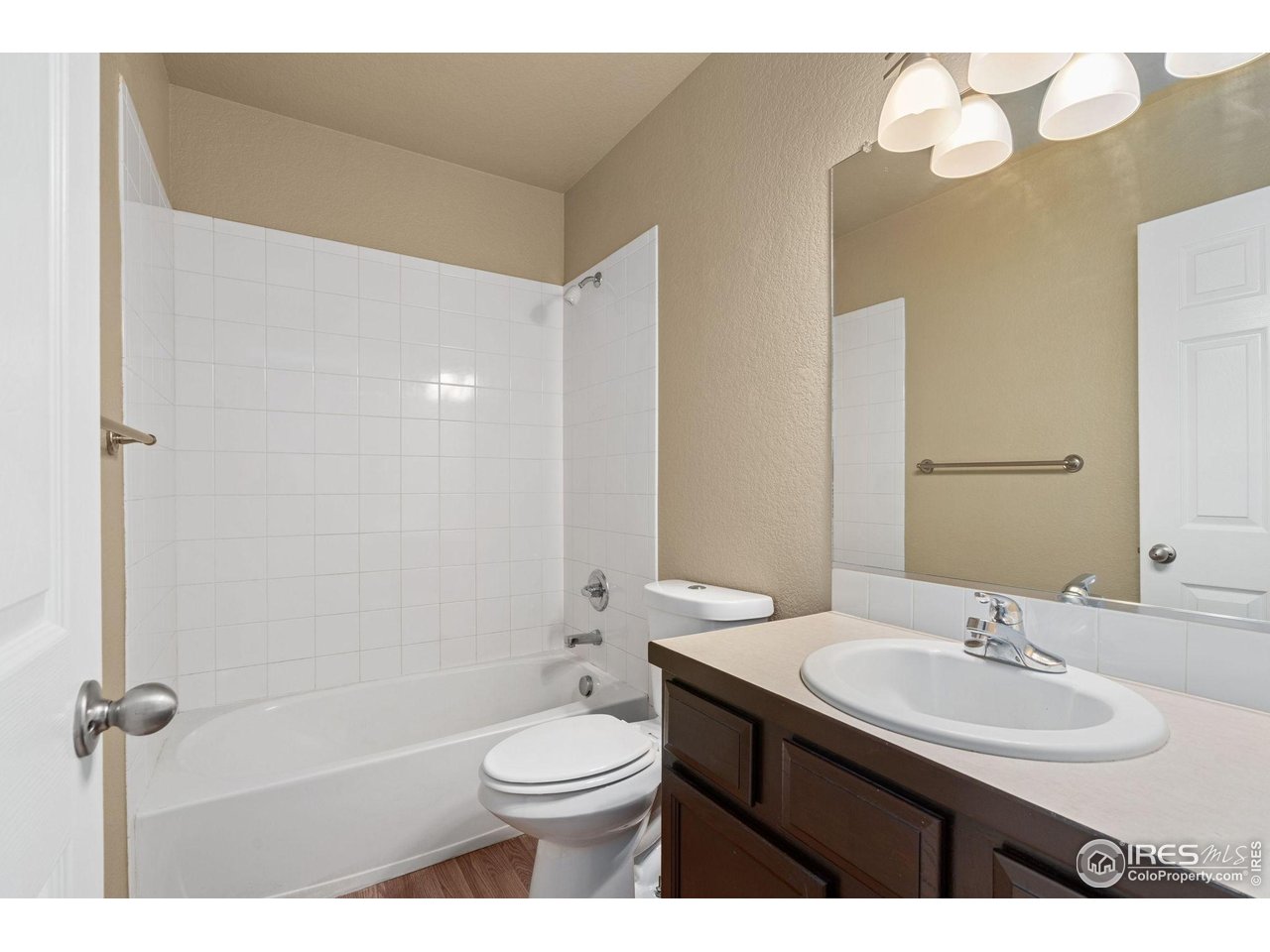 6925 19th Street, Unit 15 Greeley, CO 80634 - Photo 22 of 32 a bathroom with a sink a toilet and shower