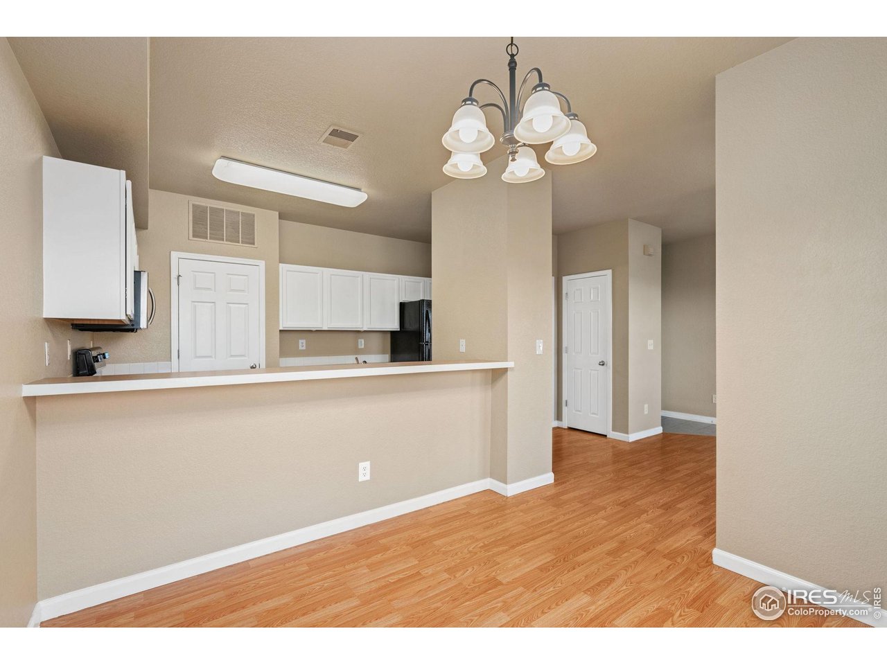 6925 19th Street, Unit 15 Greeley, CO 80634 - Photo 10 of 32 a view of kitchen with granite countertop cabinets a sink and dishwasher