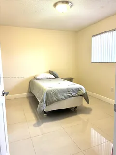 a bedroom with a bed and a cabinets