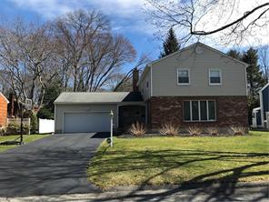 4 Concord Place Rye Brook, NY 10573 - Photo 1 of 1 a front view of house with yard and trees in the background